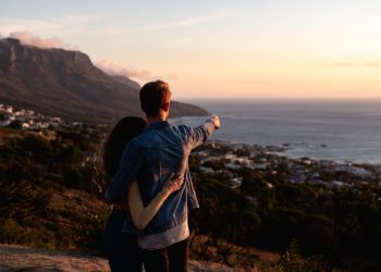 featured image of couple looking at beach for Bitcoin article