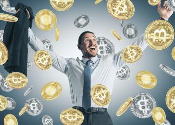 Picture of a businessman smiling as it rains bitcoins