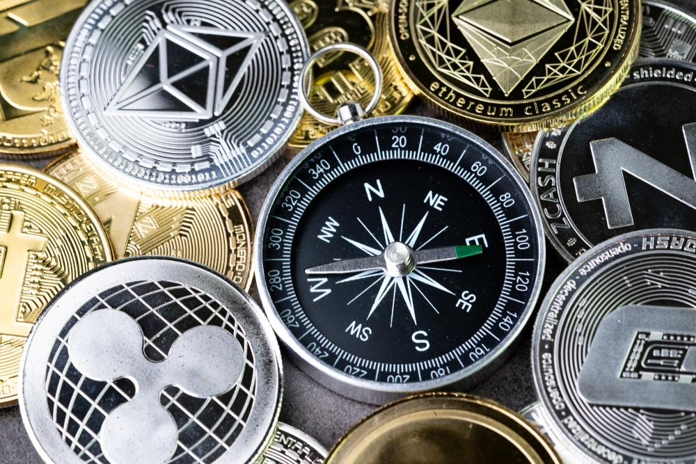 Picture of altcoins surrounding a compass