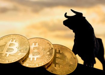 Picture of three bitcoins in front a shadowy bull figure standing on a cliff