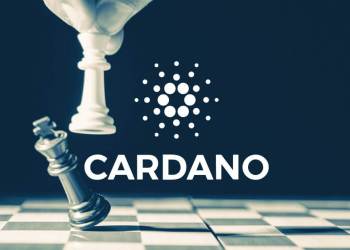 Picture of a hand playing chess with Cardano and its logo on top of it