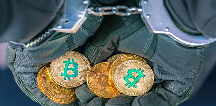 Bitcoin in handcuffed hands sweden