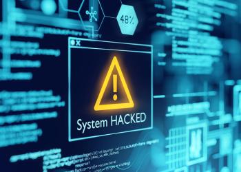 Picture of a computer screen with a box with a caution symbol with system hacked written underneath it, depicting Poly Network crypto hack