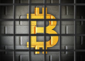picture of a bitcoin locked behind prison bars