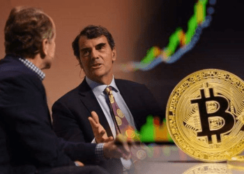 Picture of Tim Draper talking to a show host, with a bitcoin and chart lines next to him