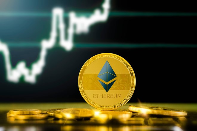 Picture of a gold Ethereum coin standing in front of an upward moving chart