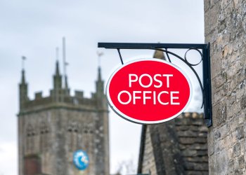 Picture of a red and white Post Office sign