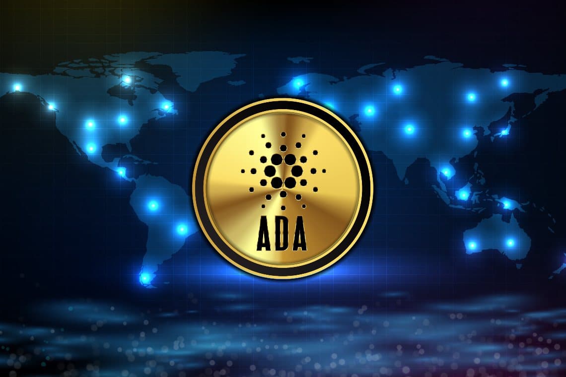Picture of a Cardano (ADA) coin in front of a map of the world