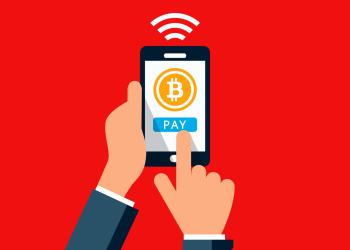 Picture of an animated hand clicking pay with bitcoin on a cellphone