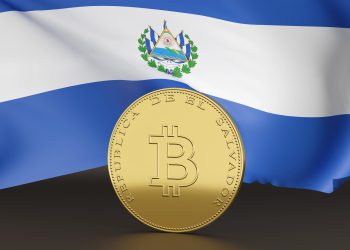 Picture of a bitcoin in front a flag of El Salvador