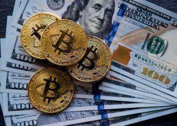 Picture of bitcoin on dollar notes