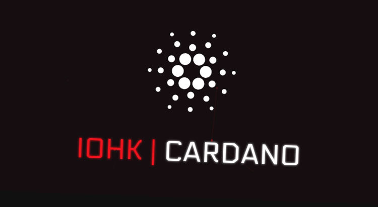 picture of Cardano developer IOHK next to the Cardano logo
