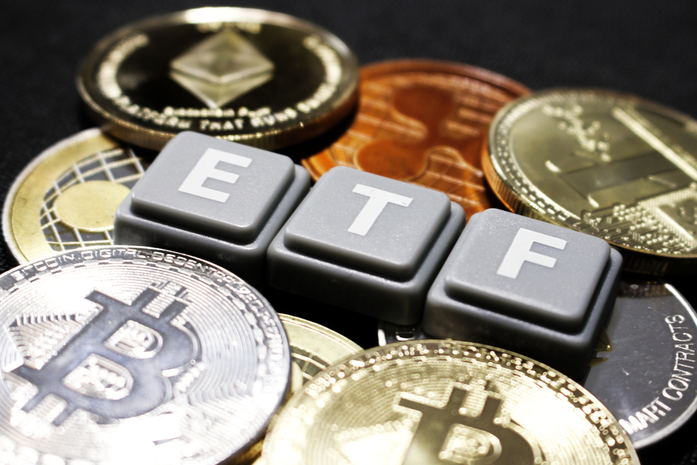 Picture of Scrabble tiles spelling ETF with bitcoins around it