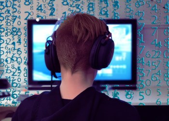 Blockchain gaming, a gamer in front of a computer