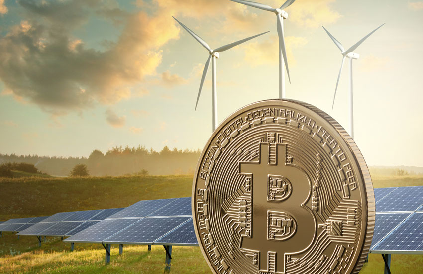 Picture of a Bitcoin with wind vanes and solan panels behind it