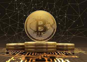 A bitcoin standing on other coins