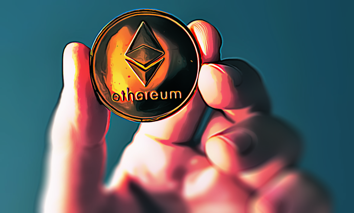 Hand holding Ethereum coin