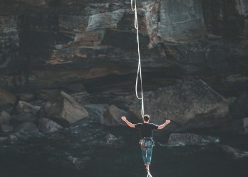 Merge, a man over a tight rope