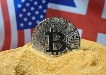 pound sterling, bitcoin in front of UK and USA flags
