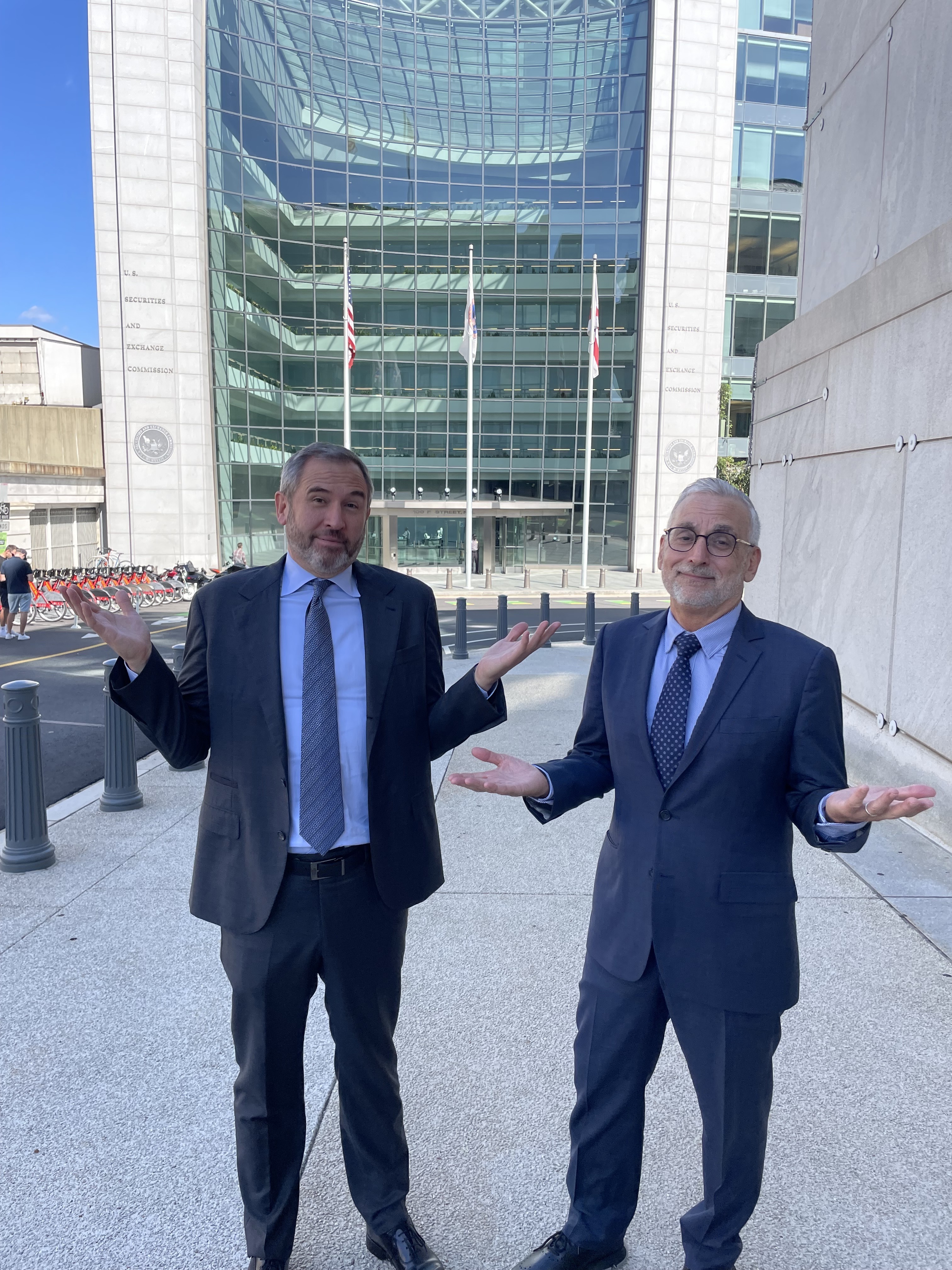 Ripple CEO Garlinghouse and CLO Alderoty in front of the SEC building